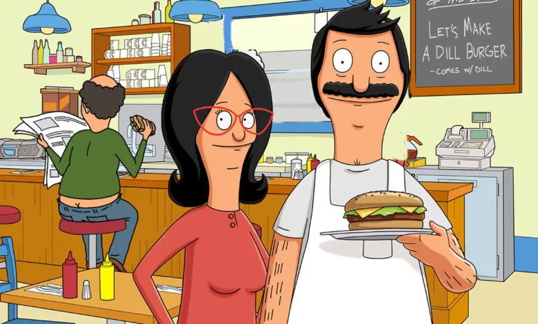 Bob standing in his burger restaurant with his wife